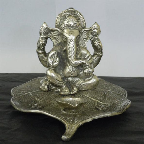 Lightahead® Lord Ganesh Ganapati The Elephant god statue figure Diya candle stand tea light holder on leaf in White Metal