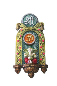A colored statue of Lord Ganesh Ganpati OM Shree Wall Hanging with bells Elephant Hindu God made from Marble powder in India